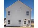White two-story home with an outdoor living space, covered patio, and manicured lawn at 2202 Catawba Trace Dr, Catawba, NC 28609