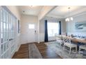 Bright dining room with elegant chandelier, large window, and stylish furniture that creates an inviting ambiance at 2296 Idol Rock Dr, Indian Land, SC 29707