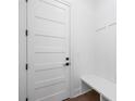 Inviting entryway featuring board and batten and a built-in bench at 302 Lincoln St, Belmont, NC 28012