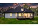 Inviting back exterior with a large deck, perfect for entertaining and relaxation at 3732 Whitney Ne Dr, Hickory, NC 28601