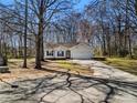 Exterior of a cute one story house with a garage and a shady yard at 4901 Sandstone Ln, Monroe, NC 28110