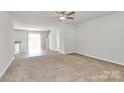 Open-concept living area leading to the kitchen with plenty of natural light at 508 Hawley St, Charlotte, NC 28214