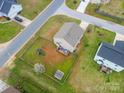 Aerial view of the property highlights a spacious, fenced backyard with a play area at 552 Montgomery Dr, Rock Hill, SC 29732