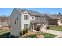 A charming two-story home with vinyl siding and a well-maintained front yard at 7217 Kenyon Dr, Denver, NC 28037