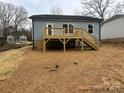 Backyard with a raised deck and stairs at 917 Moose St, Gastonia, NC 28056