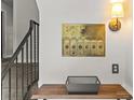 Interior view of mailboxes with a small table and staircase nearby at 108 Colville Rd # 21B, Charlotte, NC 28207