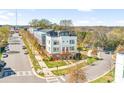 Modern townhome street view with sidewalks, landscaping, and convenient street parking at 111 W Poindexter Dr, Charlotte, NC 28203