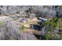 Birds eye view of property featuring wooded area, home, and barn at 1366 Vashti Rd, Taylorsville, NC 28681