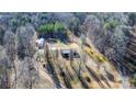 Expansive aerial view of the home featuring forested surroundings and long driveway at 1366 Vashti Rd, Taylorsville, NC 28681