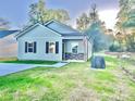 Charming single-story home featuring stone accents, fresh landscaping, and a welcoming front entrance at 140 Swimmers Ln, Salisbury, NC 28146