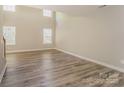 Bright living room featuring new floors, neutral paint, large windows, and a soaring ceiling at 1471 Andora Dr, Rock Hill, SC 29732
