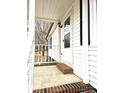 Cozy front porch with white railings, leading to the entrance of this lovely home at 1607 W Nc 27 Hwy, Lincolnton, NC 28092