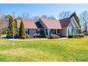 Attractive one-story home featuring a well-manicured lawn and established landscaping at 1636 Samaria Ln, Conover, NC 28613