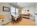 Cozy dining room with natural light, neutral paint, and tile floors at 19009 Coachmans Trce, Cornelius, NC 28031