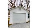 Detached one car garage with white door, perfect for parking and extra storage space at 211 W 1St St, Landis, NC 28088
