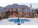 Luxury home features a brick exterior, an inground pool, and a spacious backyard at 3200 Beaty Rd, Gastonia, NC 28056