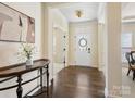 Inviting foyer with hardwood floors, a decorative table, and views into other rooms at 5059 Saint Clair St, Fort Mill, SC 29715