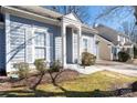 Charming front of the home featuring large windows with white shutters at 5616 Ebley Ln, Charlotte, NC 28227