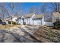 Well-maintained single-story home with an attached garage and a tidy lawn at 5616 Ebley Ln, Charlotte, NC 28227