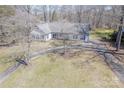 Expansive aerial view showcasing the home's layout, surrounded by lush greenery and a sprawling driveway at 10101 Woodview Cir, Charlotte, NC 28277
