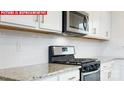 Well-lit kitchen with granite countertops and stainless steel appliances at 11220 Cardinal Creek Ave, Charlotte, NC 28215