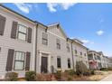 Attractive townhome exterior with neat landscaping and classic architectural details at 118 Mint Ave # B, Mooresville, NC 28117