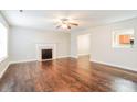 Cozy living room featuring hardwood floors, a decorative fireplace, and natural light at 1212 Shenandoah Cir, Rock Hill, SC 29730