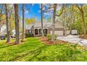 Beautiful single-Gathering home featuring a well-maintained lawn and brick elevation at 12228 Plover Dr, Charlotte, NC 28269