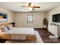 Serene bedroom with hardwood floors, a ceiling fan, a cozy area rug and a bright window, perfect for restful nights at 1420 Hickory Nut Ln, Lincolnton, NC 28092