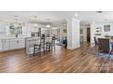 Spacious kitchen with white cabinets, an island with seating, and a modern stainless steel refrigerator at 2052 10Th Street Nw Pl, Hickory, NC 28601