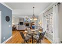 Open-concept living space with dining area, a cozy seating area, and a fireplace at 3119 18Th Ne St, Hickory, NC 28601