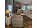 Bright living room with vaulted ceilings, stone fireplace, and comfortable seating arrangement at 319 Vista Grande Cir, Charlotte, NC 28226