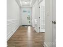 Bright entryway with light wood flooring, white walls, and a view of the front door at 4009 Grace Pointe Dr # 101, Indian Trail, NC 28079