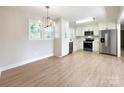 Open-concept kitchen with stainless steel appliances and eat-in area, perfect for casual dining at 418 Dallas Stanley Hwy, Dallas, NC 28034