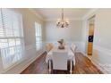 Dining room with decorative lighting and a view of the kitchen and living room at 504 Galesburg Dr, Monroe, NC 28110