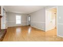 Spacious living room with hardwood floors and neutral paint for a bright, airy feel at 570 Scaleybark Rd, Rock Hill, SC 29732