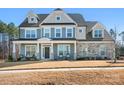Stunning two-story home with a manicured lawn and a welcoming front porch showing incredible curb appeal at 835 Yucatan Dr, Waxhaw, NC 28173