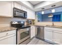 Modern kitchen with stainless steel appliances and granite countertops at 9427 S Vicksburg Park Ct, Charlotte, NC 28210