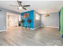 Bright, open living room with ceiling fan and modern flooring at 9427 S Vicksburg Park Ct, Charlotte, NC 28210