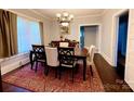 Elegant dining room with a large table and classic chandelier at 127 E 11Th St, Salisbury, NC 28144