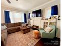 Cozy living room with a sectional sofa and a patterned rug at 127 E 11Th St, Salisbury, NC 28144