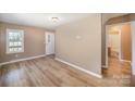 Bright room featuring neutral walls, new flooring, and an adjacent bathroom at 15 Gumtree St, Wadesboro, NC 28170