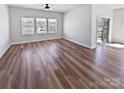Bright living room featuring hardwood floors, large windows, and lots of natural light at 2018 Hyacinth Ct, Denver, NC 28037