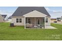 Spacious backyard featuring a covered patio perfect for outdoor living and entertaining at 2018 Mantle Ridge Dr, Indian Trail, NC 28079