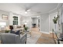 Bright living room with hardwood floors open to kitchen offering an airy open layout at 208 Hollifield St, Gastonia, NC 28056