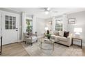 Cozy living room with neutral tones, ample natural light, and stylish decor at 208 Hollifield St, Gastonia, NC 28056