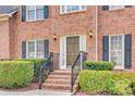 Close up of the front entrance of a brick home with black shutters, showcasing a welcoming entryway at 2955 Eppington South Dr, Fort Mill, SC 29708