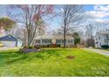 Charming home with a well-manicured lawn, symmetrical facade, and tasteful landscaping, enhancing its curb appeal at 3842 Saxonbury Way, Charlotte, NC 28269