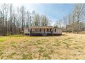 Lovely single-story home with a sprawling front lawn and inviting front porch at 4604 Karwood Dr, Rock Hill, SC 29732