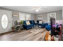 Bright living room features hardwood floors and large windows providing ample natural light at 468 Wilhelm Ne Pl, Concord, NC 28025